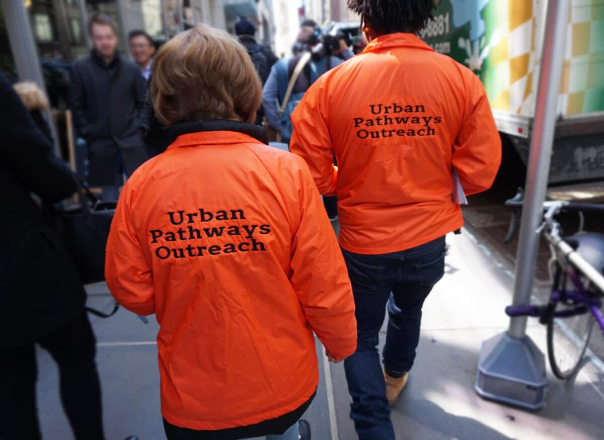 Members of Urban Pathways outreach walking down New York City street